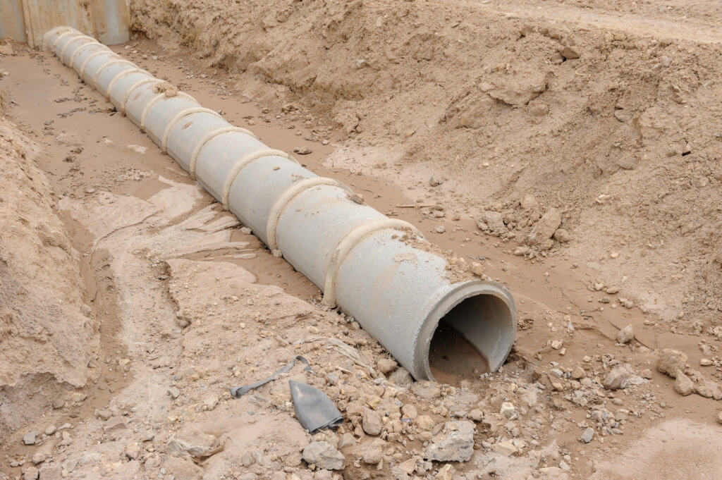 drain pipe in trench with slope