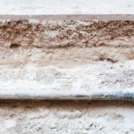 Old pipe excavation under the street asphalt