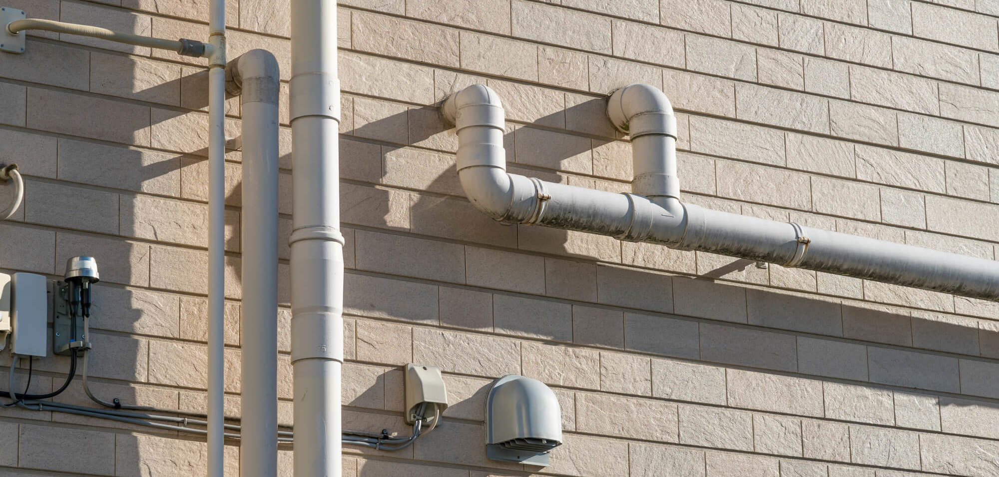 How to Hide Exterior Plumbing Pipes - Eyman Plumbing Heating & Air