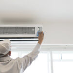 man installing air conditioning