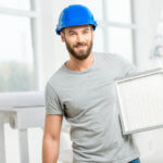 man holding HVAC filter