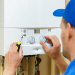 man working on boiler