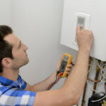 man fixing boiler